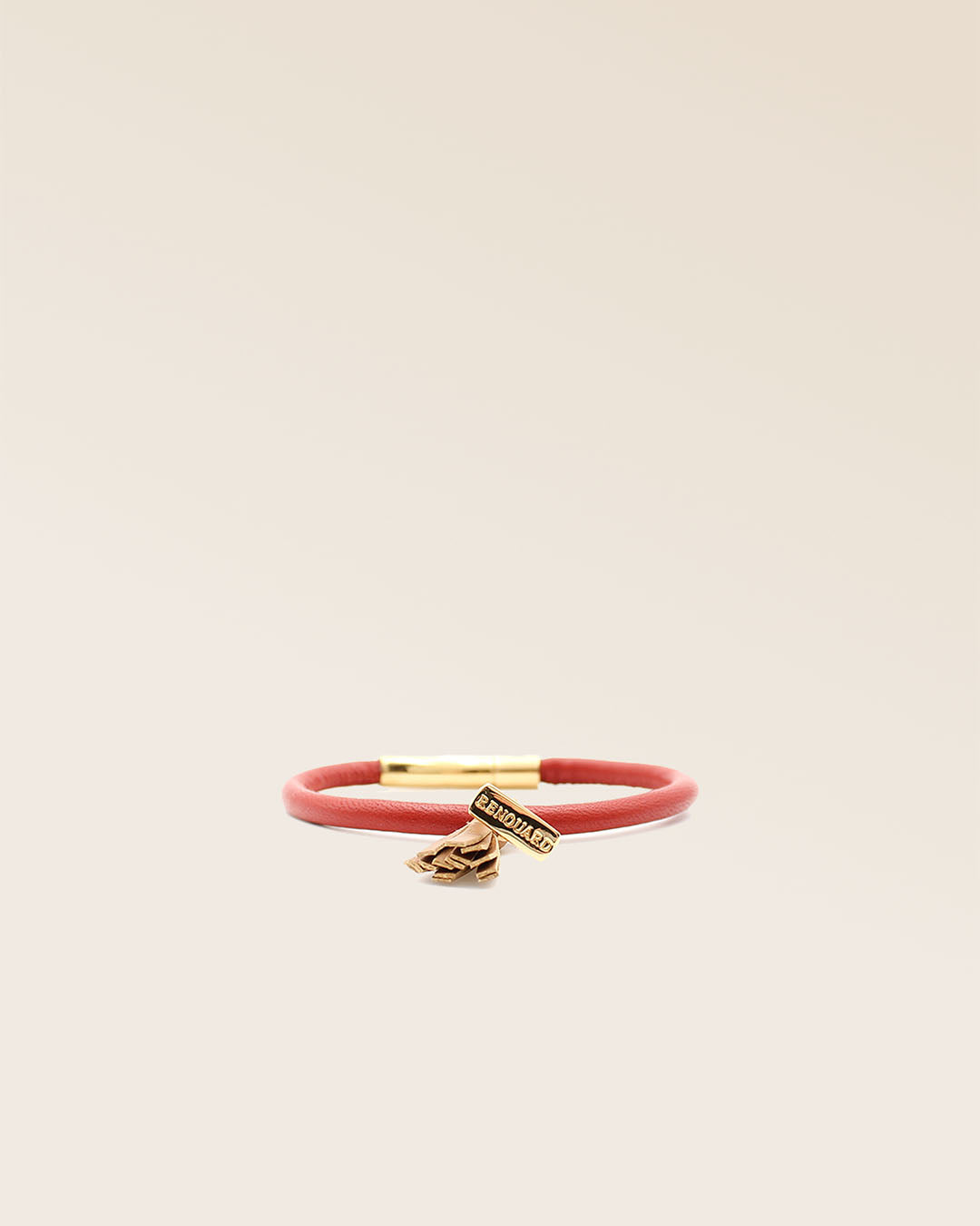 Our Jumping bracelet in terracotta lambskin and camel pompon, seen from the front in the studio.