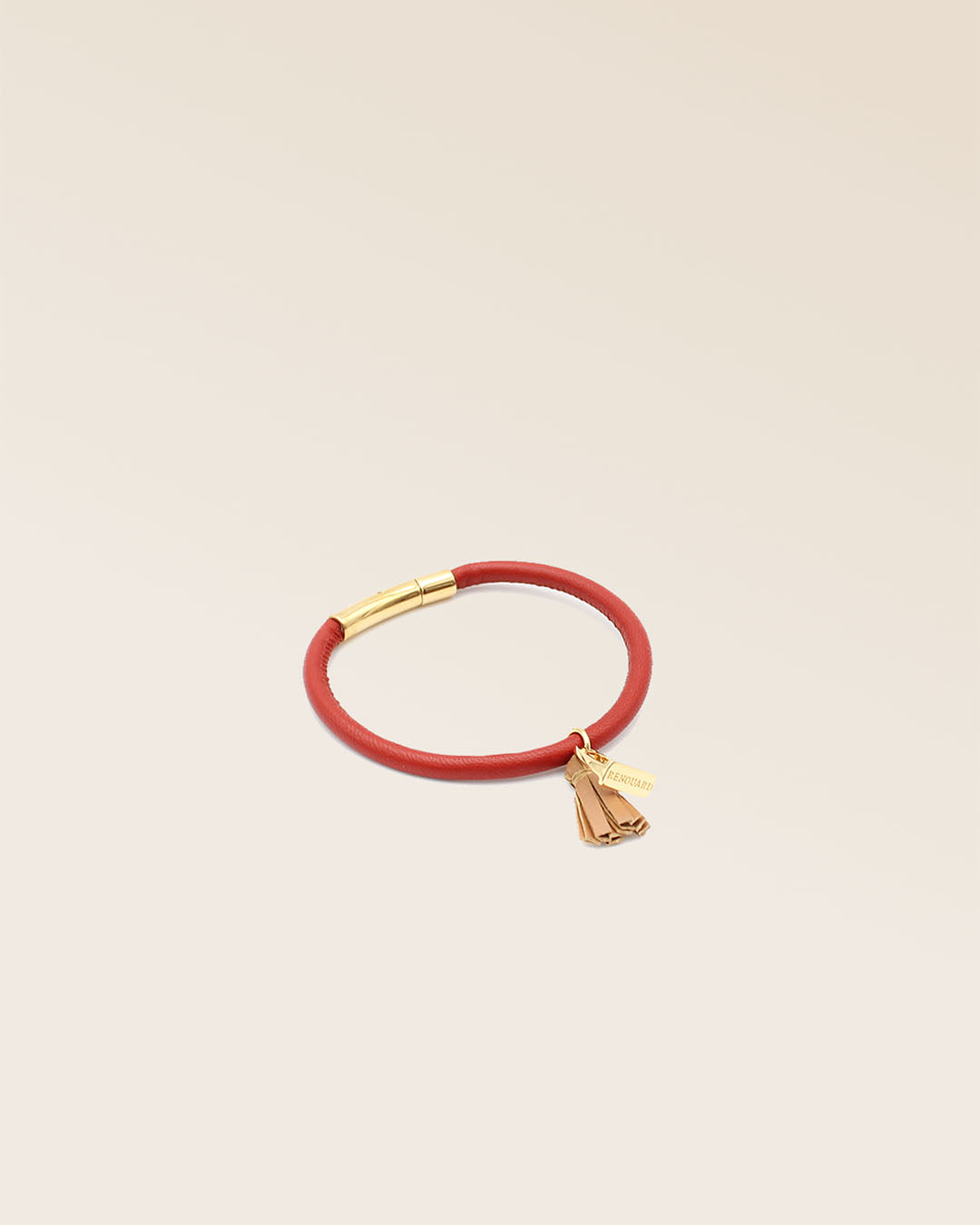 Our Jumping bracelet in terracotta lambskin and camel pompon as seen from the studio.