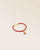 Our Jumping bracelet in terracotta lambskin and camel pompon as seen from the studio.