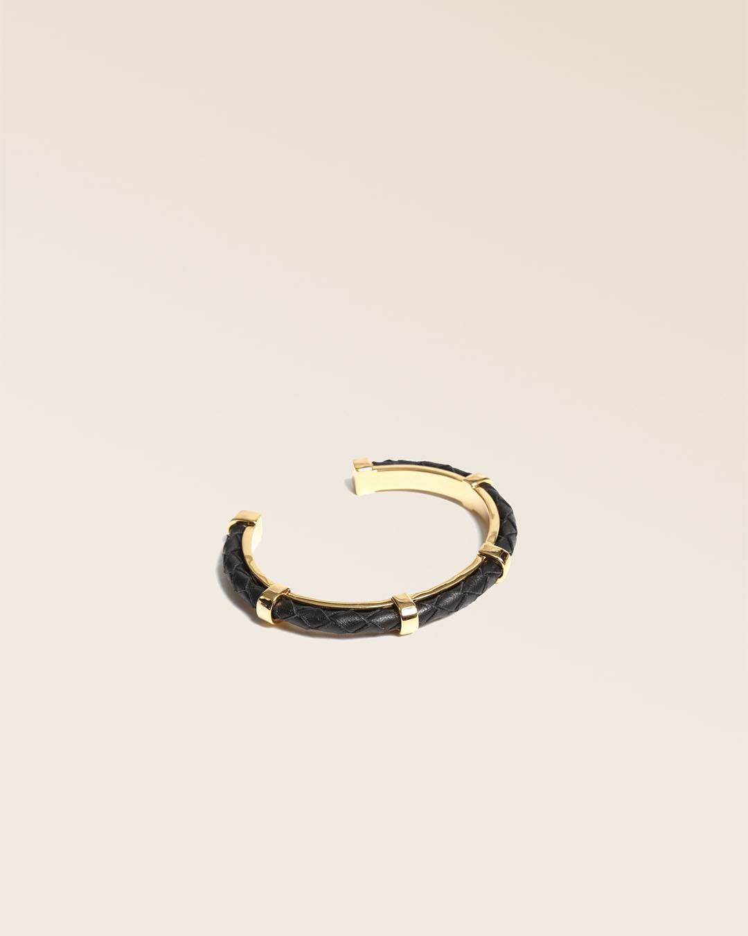 Our Lisbon bracelet in black woven lambskin seen from the quarter in the studio