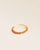 Our Lisbon bracelet in orange braided lambskin seen from the quarter in the studio.