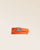 Notre bracelet Sardine nickelé en cuir façon vigogne orange vu de face en studio.