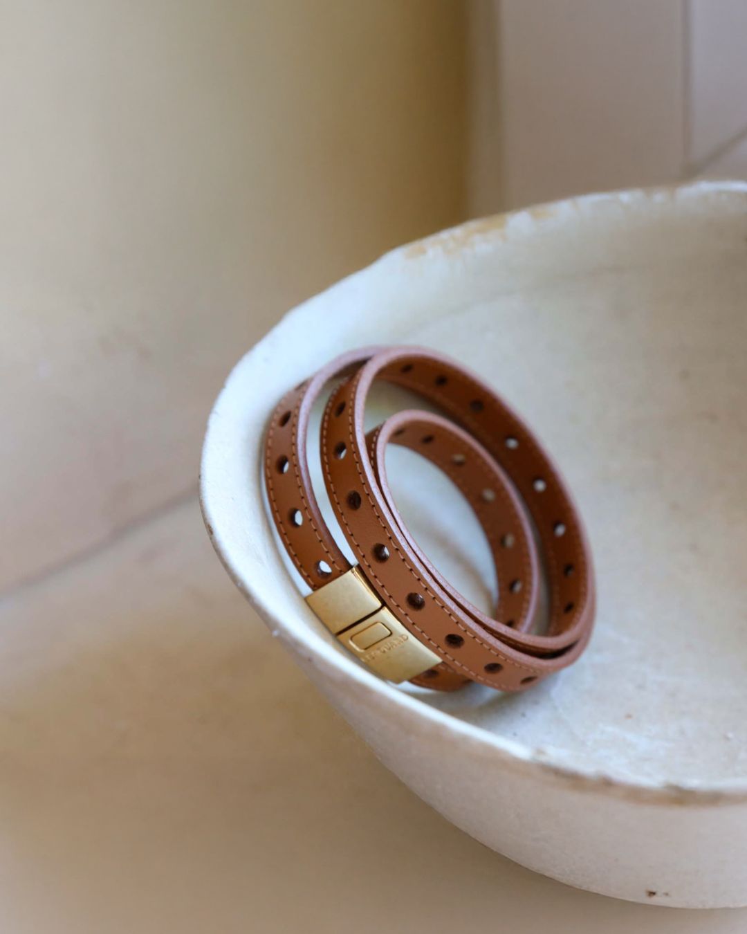 Our Totem bracelet in camel perforated lambskin seen from the front.