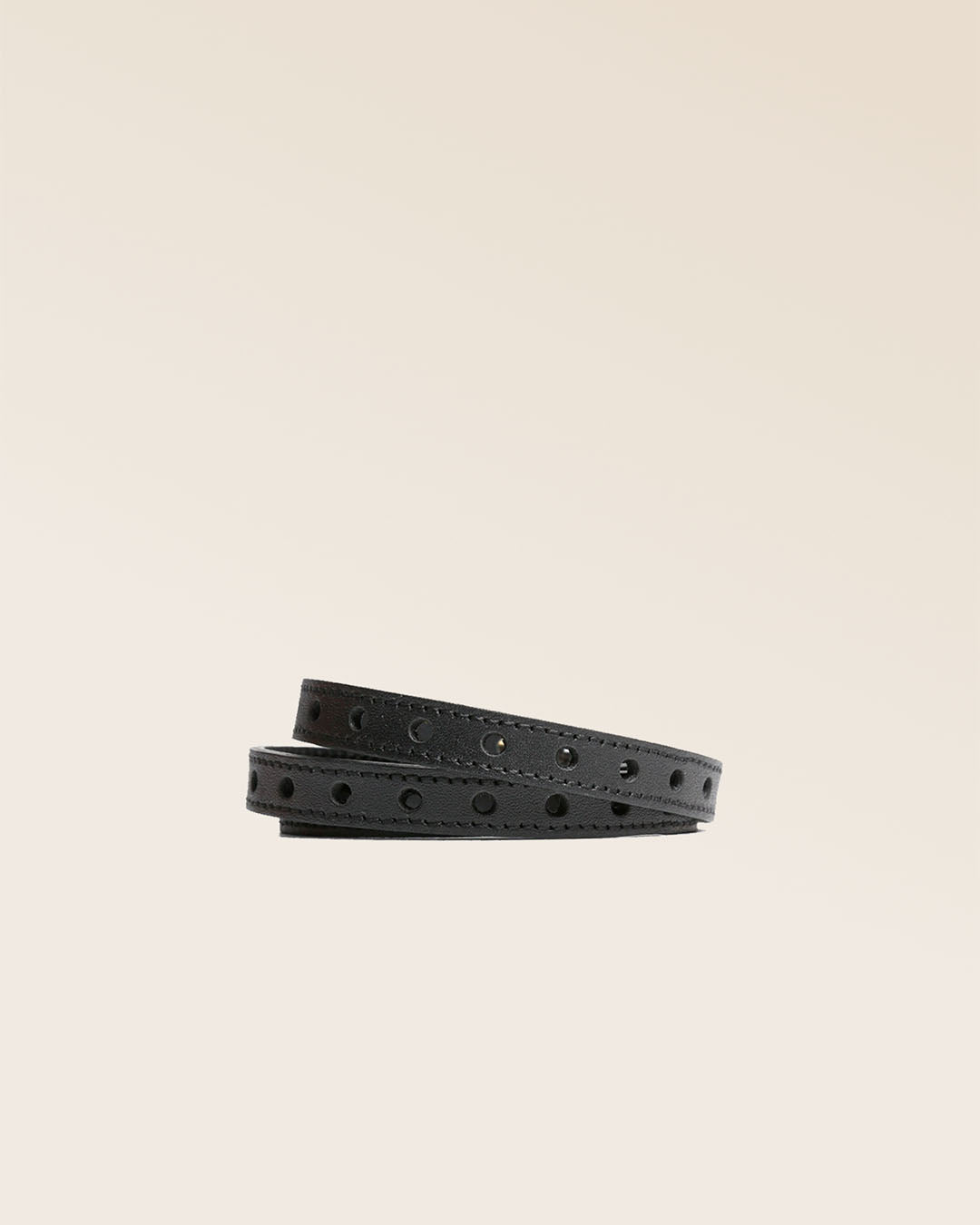 Our Totem Renouard bracelet in black perforated lambskin, seen from the front in the studio.