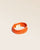 Notre bracelet Totem en cuir d'agneau perforé orange vu de quart en studio.