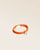 Notre bracelet Twin en cuir d'agneau orange vu de quart en studio.
