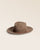 Notre chapeau Carmella Renouard en laine feutrée taupe, vu de quart en studio.