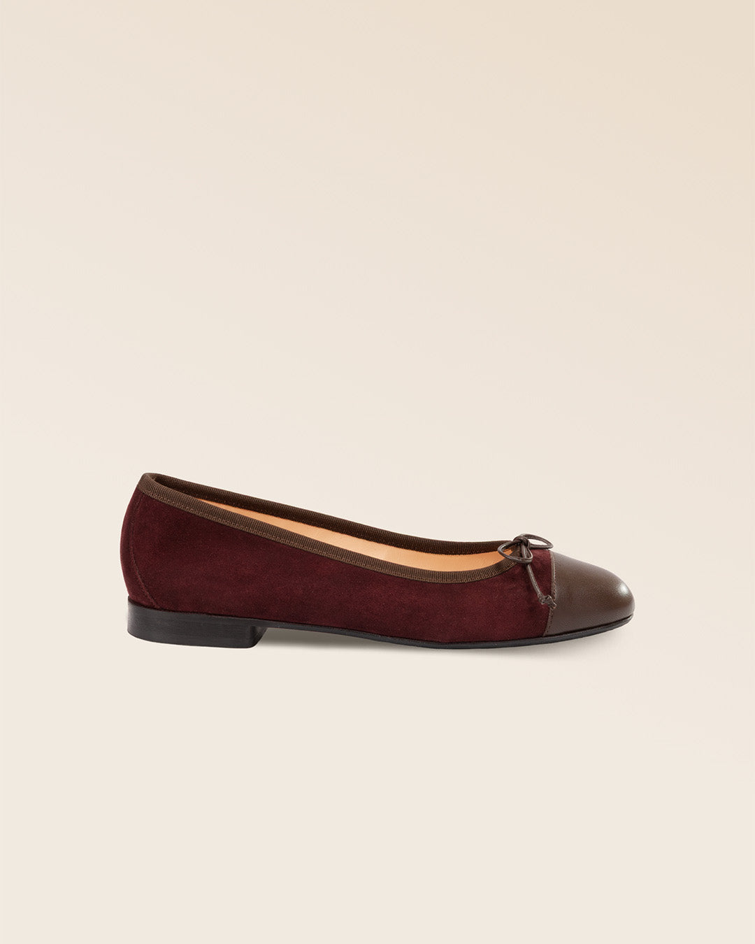 Our Friandise Renouard ballerinas in burgundy nubuck leather, seen from the side in the studio.