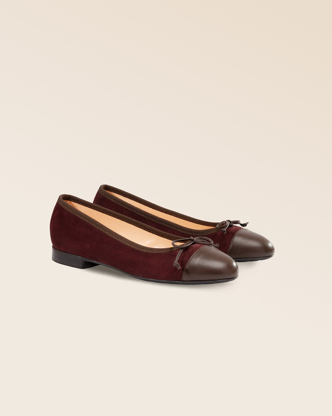 Our Friandise Renouard ballerinas in burgundy nubuck leather, seen from the quarter in the studio.