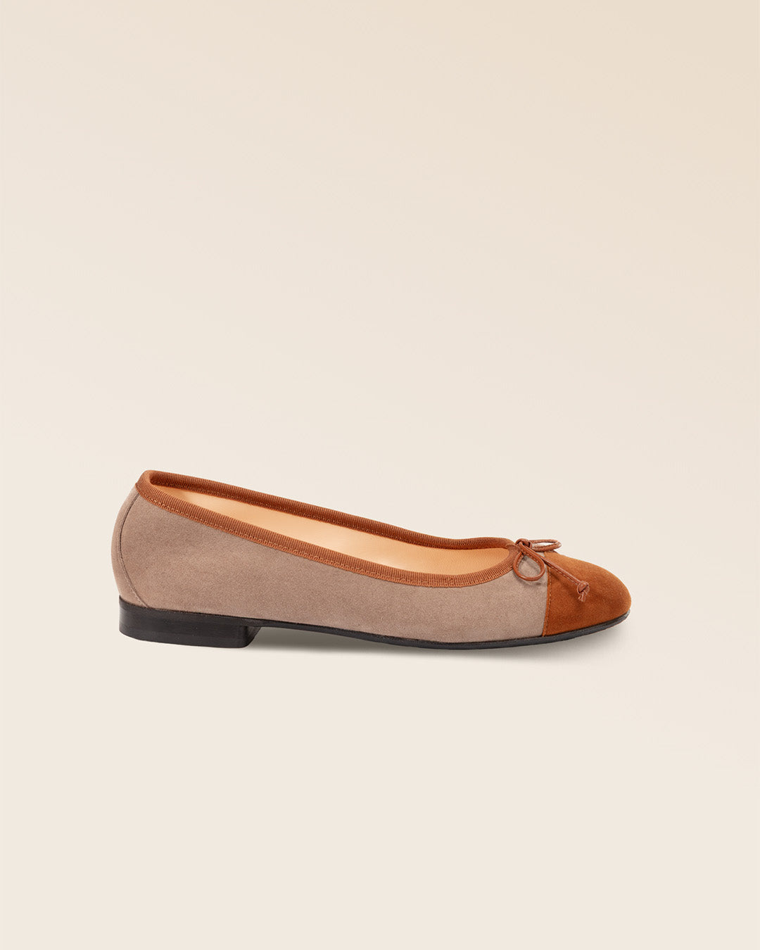 Our Friandise Renouard ballerinas in taupe and fawn nubuck leather, seen from the side in the studio.