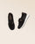 Nos mocassins Elie Renouard en cuir nubuck noir, vus en studio.