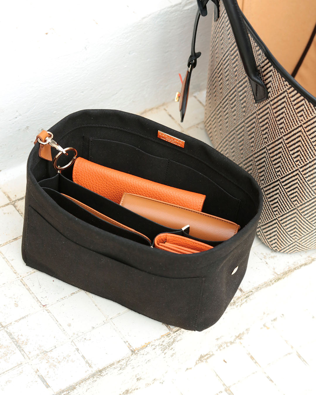 Our black suede bag organizer seen in ambiance.
