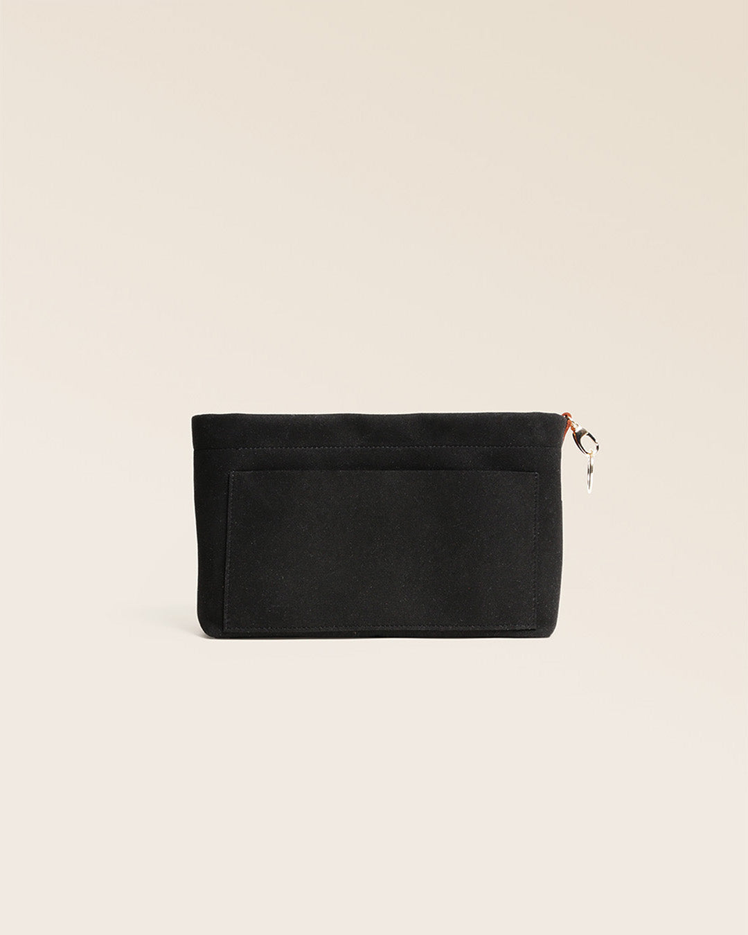Our black suede bag organizer, seen from the front in the studio.