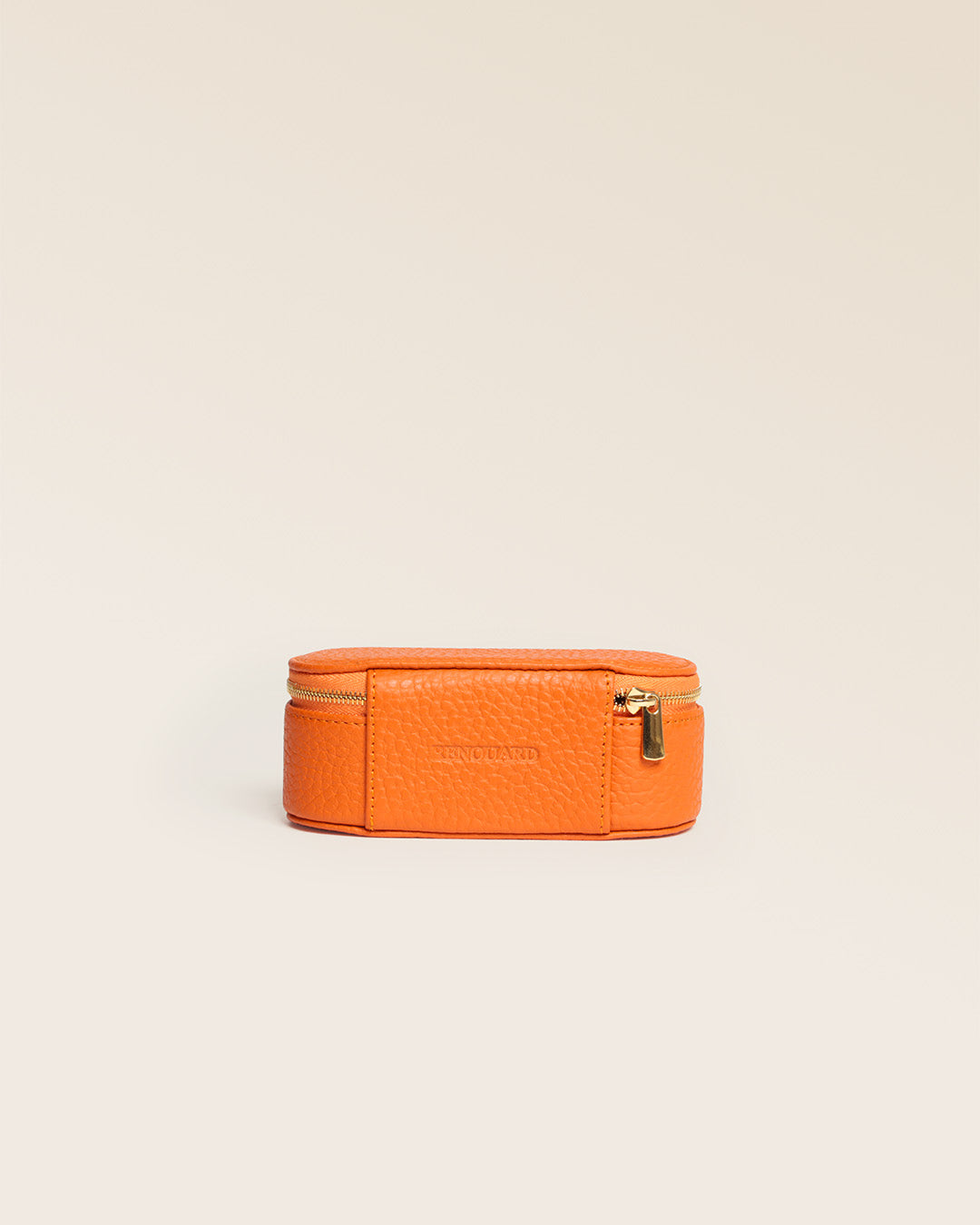 Our orange vicuña-style leather lipstick case seen from behind in the studio.