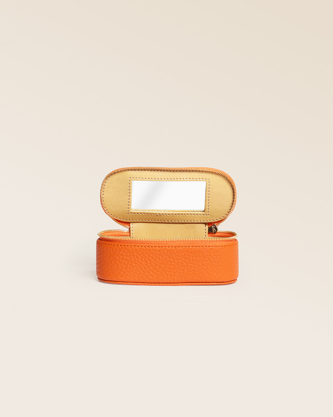 Our orange vicuña-style leather lipstick case, seen from the front and opened in the studio.