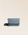 Our Coralie clutch in cobalt-blue vicuña-style leather, seen from the front in the studio.