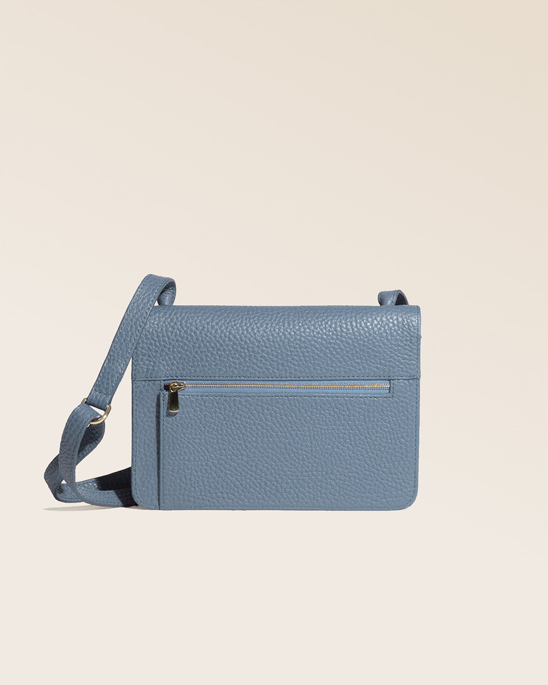 Our cobalt-blue vicuña-style leather Frehel clutch seen from the back in the studio.