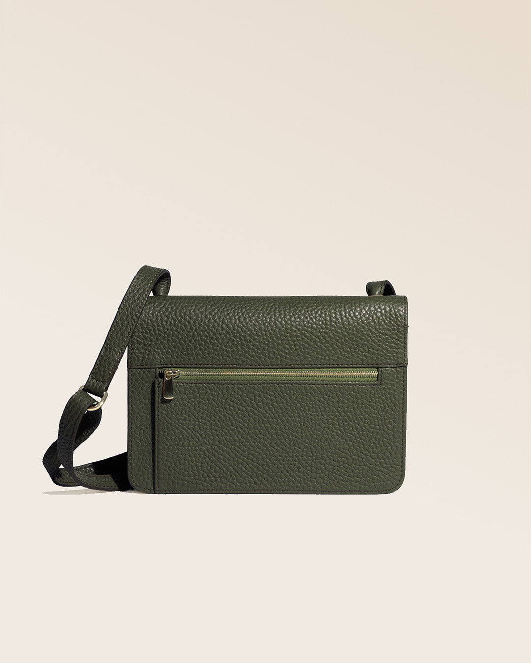 Our Frehel clutch bag in khaki vicuña-style leather, seen from the back in the studio.