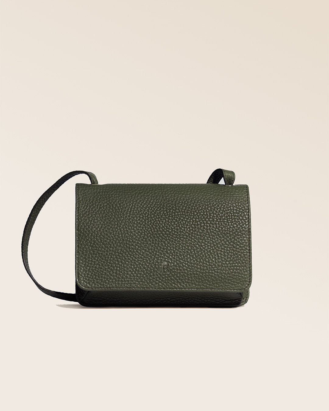 Our Frehel clutch bag in khaki vicuña-style leather, seen from the front in the studio.