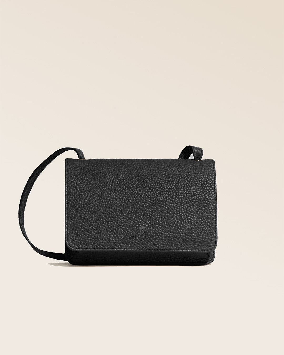 Our Frehel pouch in black vicuña-style leather, seen from the front in the studio.