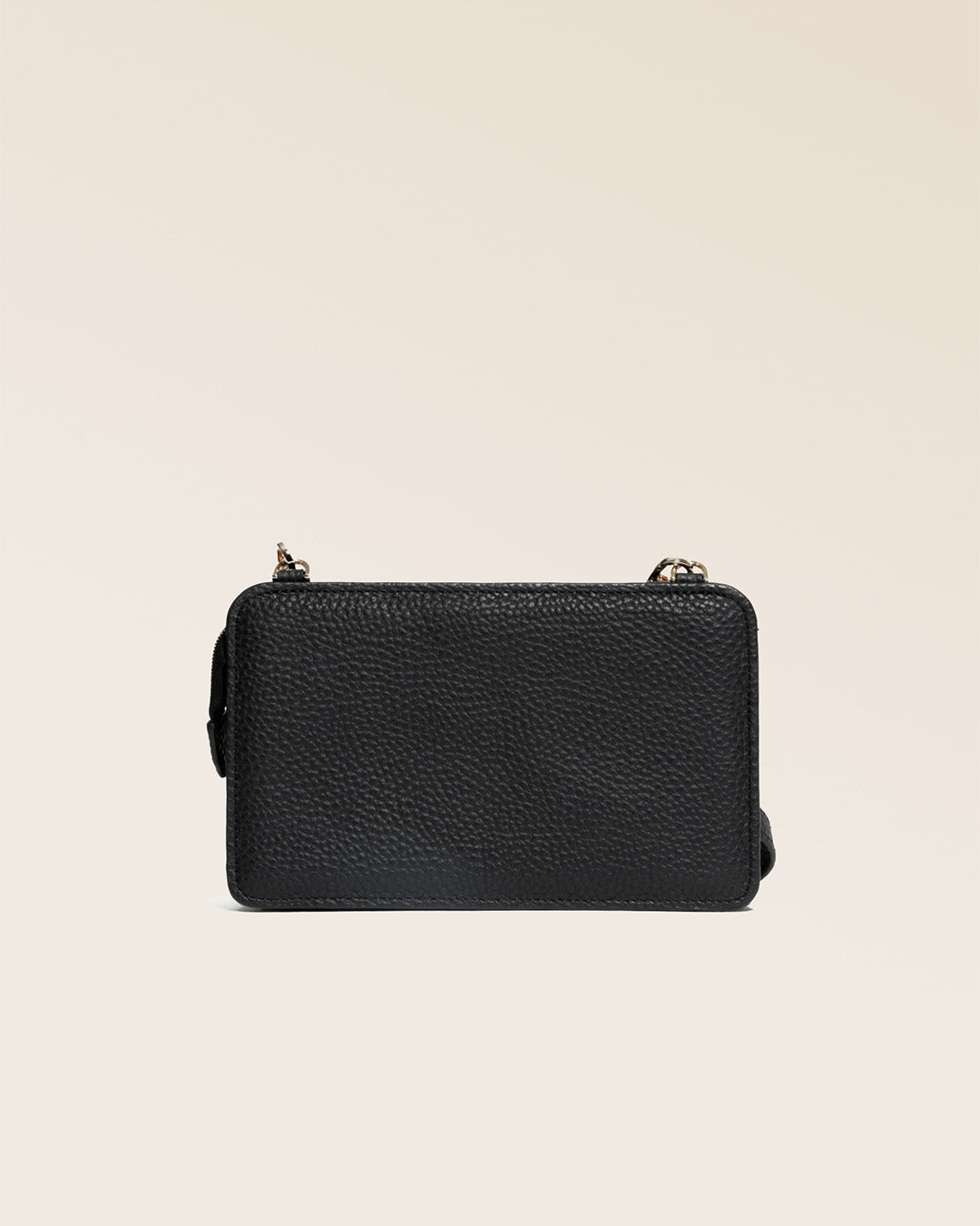 Our black vicuña-style leather Manolo clutch seen from the back in the studio.