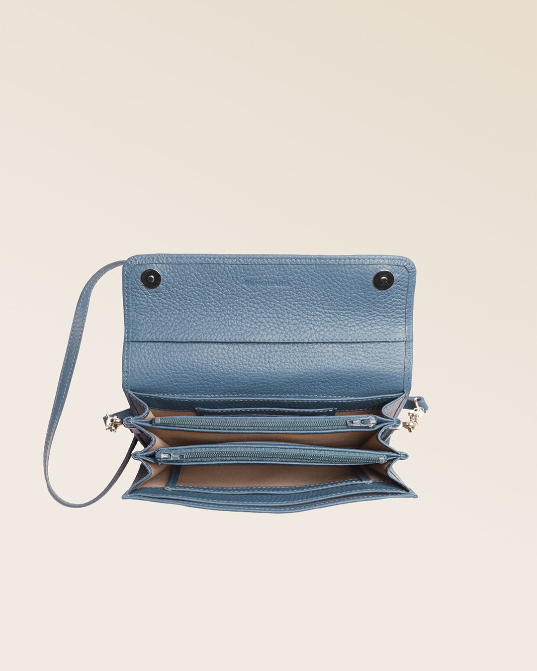 Our Raphaël clutch bag in cobalt-blue vicuña-style leather, seen from above in the studio.