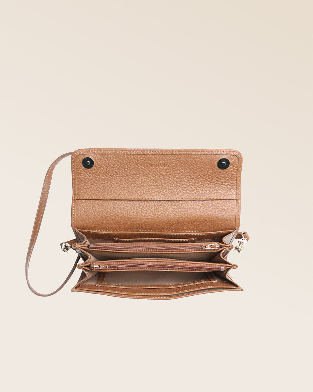 Our Raphaël Renouard clutch bag in fawn-colored vicuña leather, seen from above in the studio.
