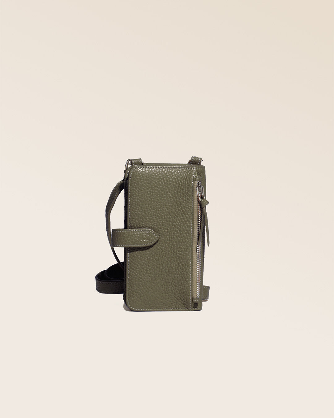 Our Tempo clutch bag in khaki vicuña-style leather, seen from the back in the studio.