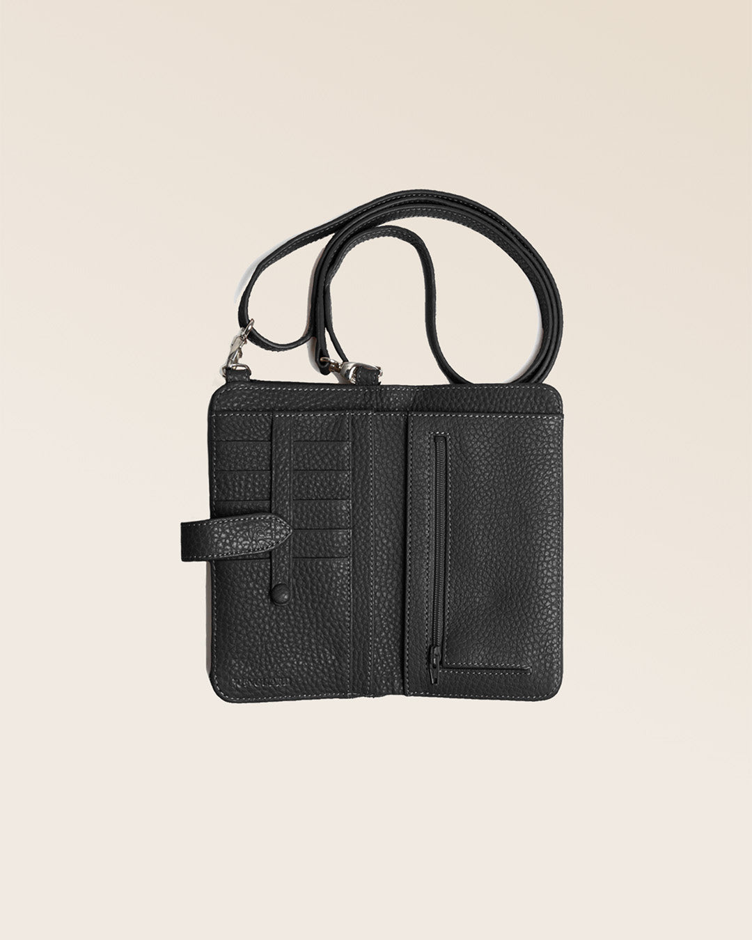 Our black vicuña-style leather Tempo clutch seen from above in the studio.
