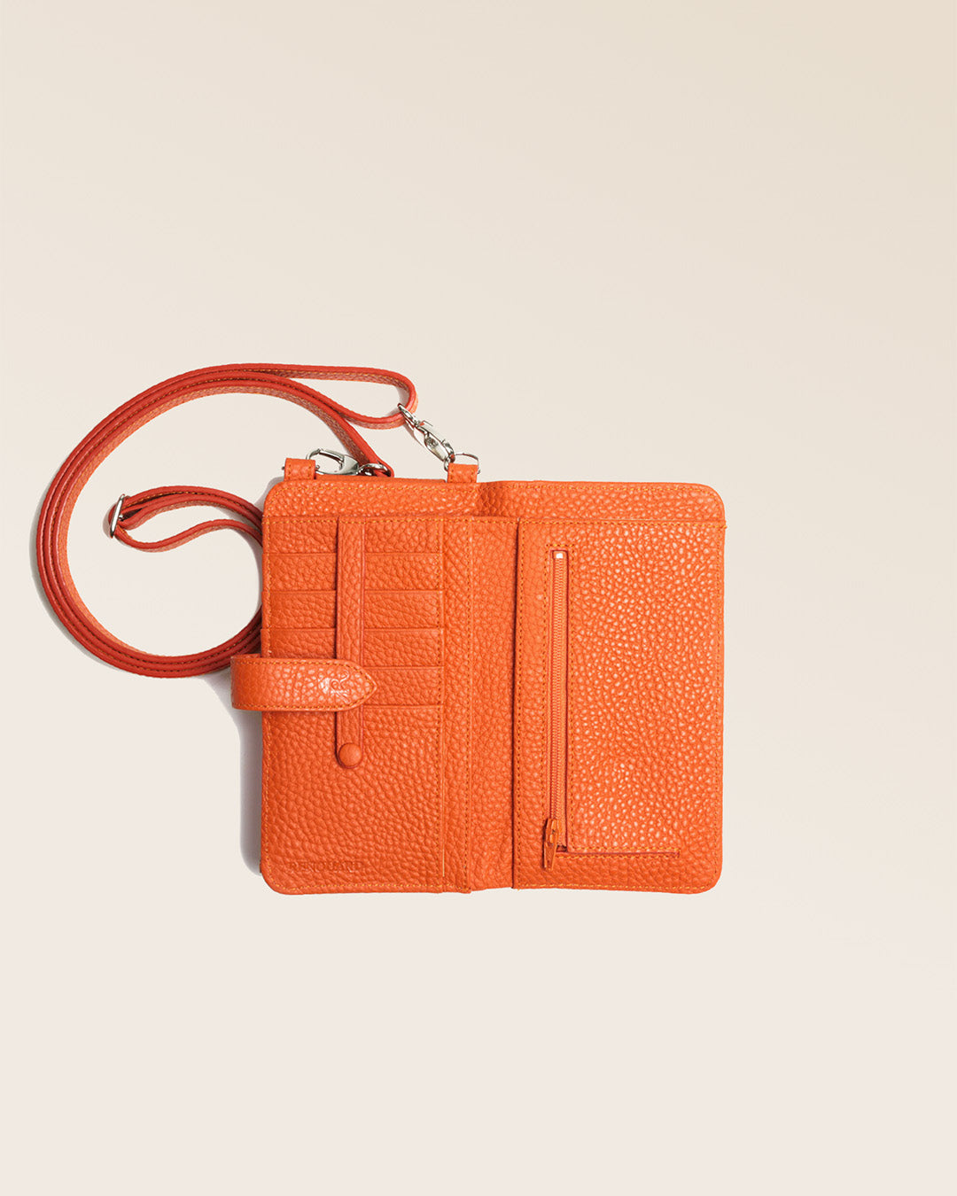 Our Tempo orange vicuña-style leather pouch seen from above in the studio.