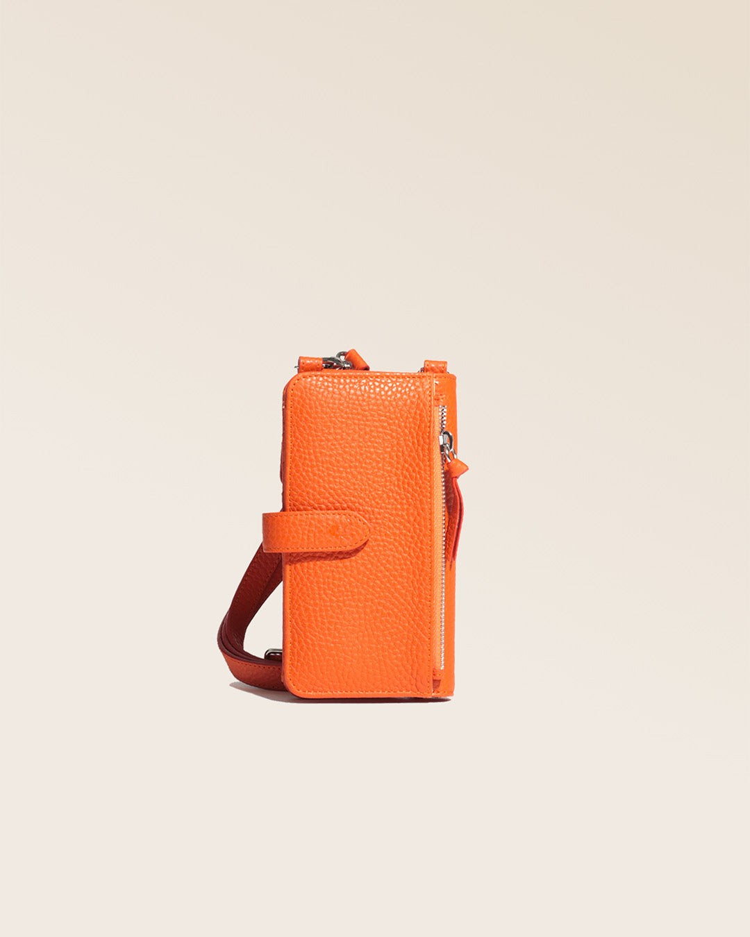 Our Tempo orange vicuña-style leather pouch seen from the back in the studio.