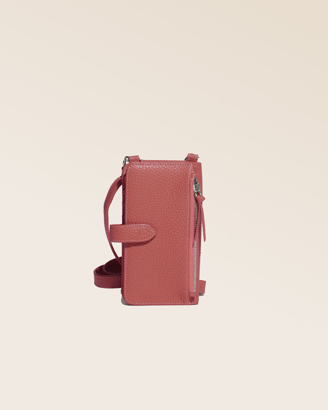 Our Tempo pouch in terracotta vicuña-style leather, seen from the back in the studio.