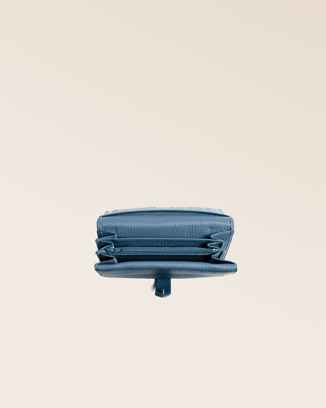 Our Adèle wallet in cobalt-blue vicuña-style leather, seen from above in the studio.