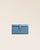 Our Adèle wallet in cobalt-blue vicuña-style leather, seen from the front in the studio.