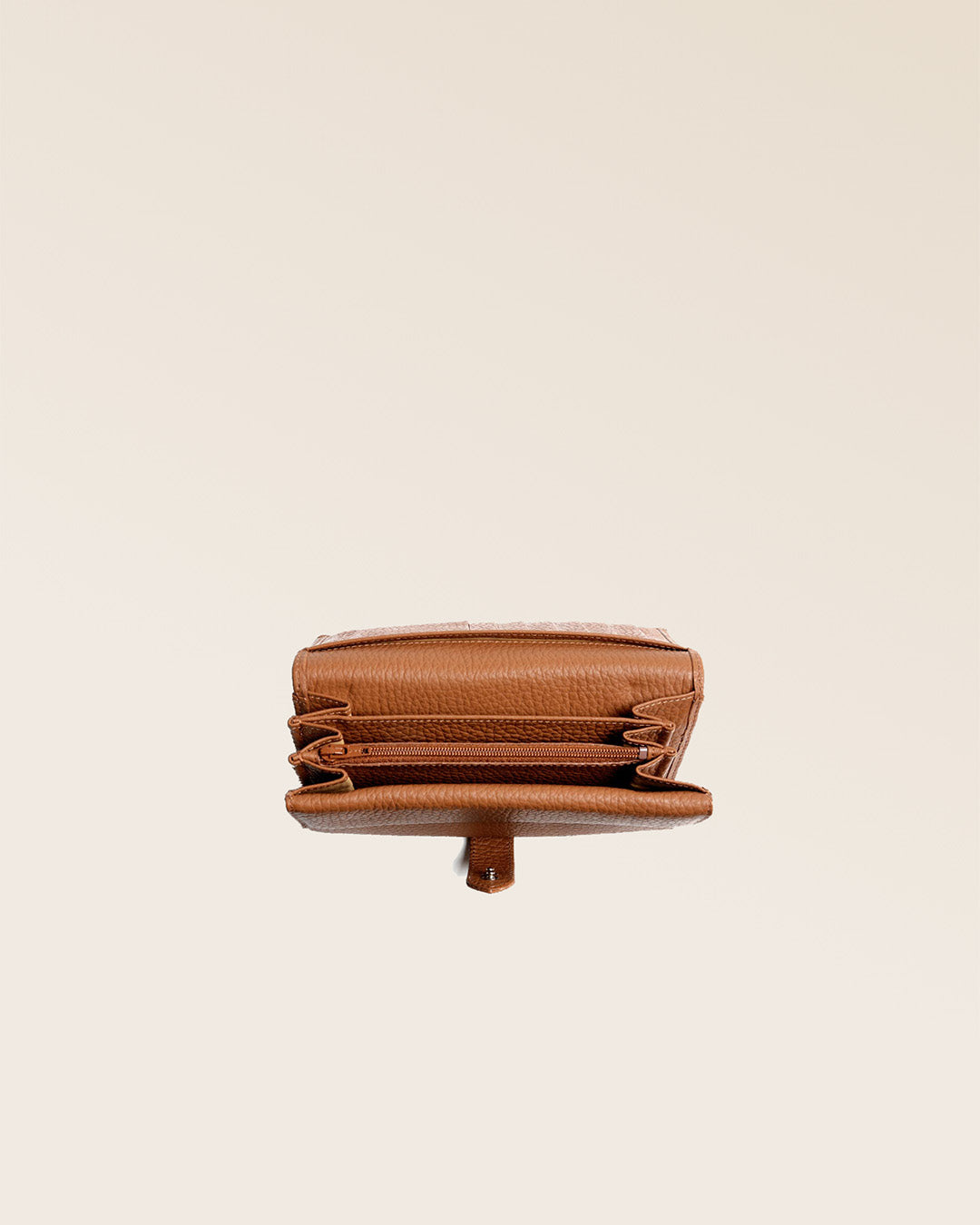 Our Adèle wallet in fawn-colored vicuña leather, seen from above in the studio.