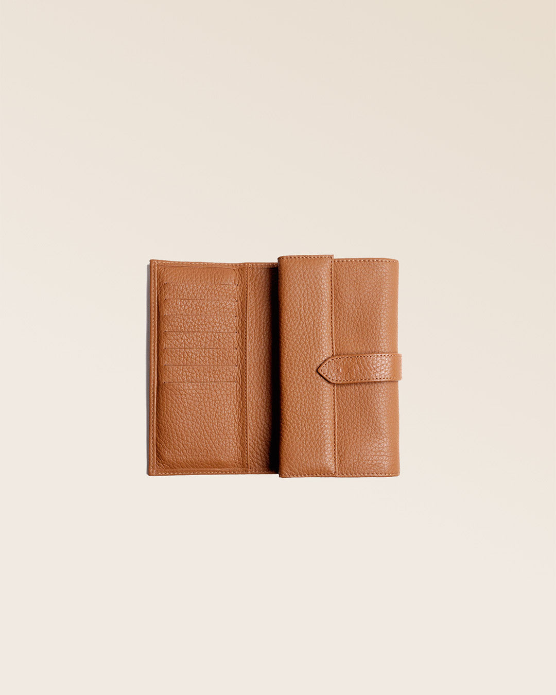 Our Adèle wallet in fawn-colored vicuña leather, seen open in the studio.