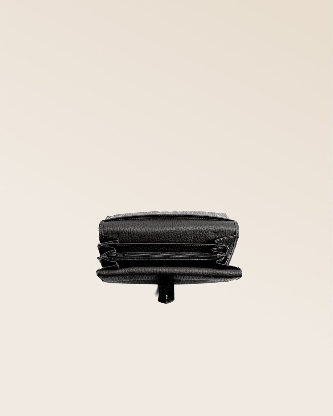 Our Adèle purse in black vicuña-style leather, seen from above in the studio.