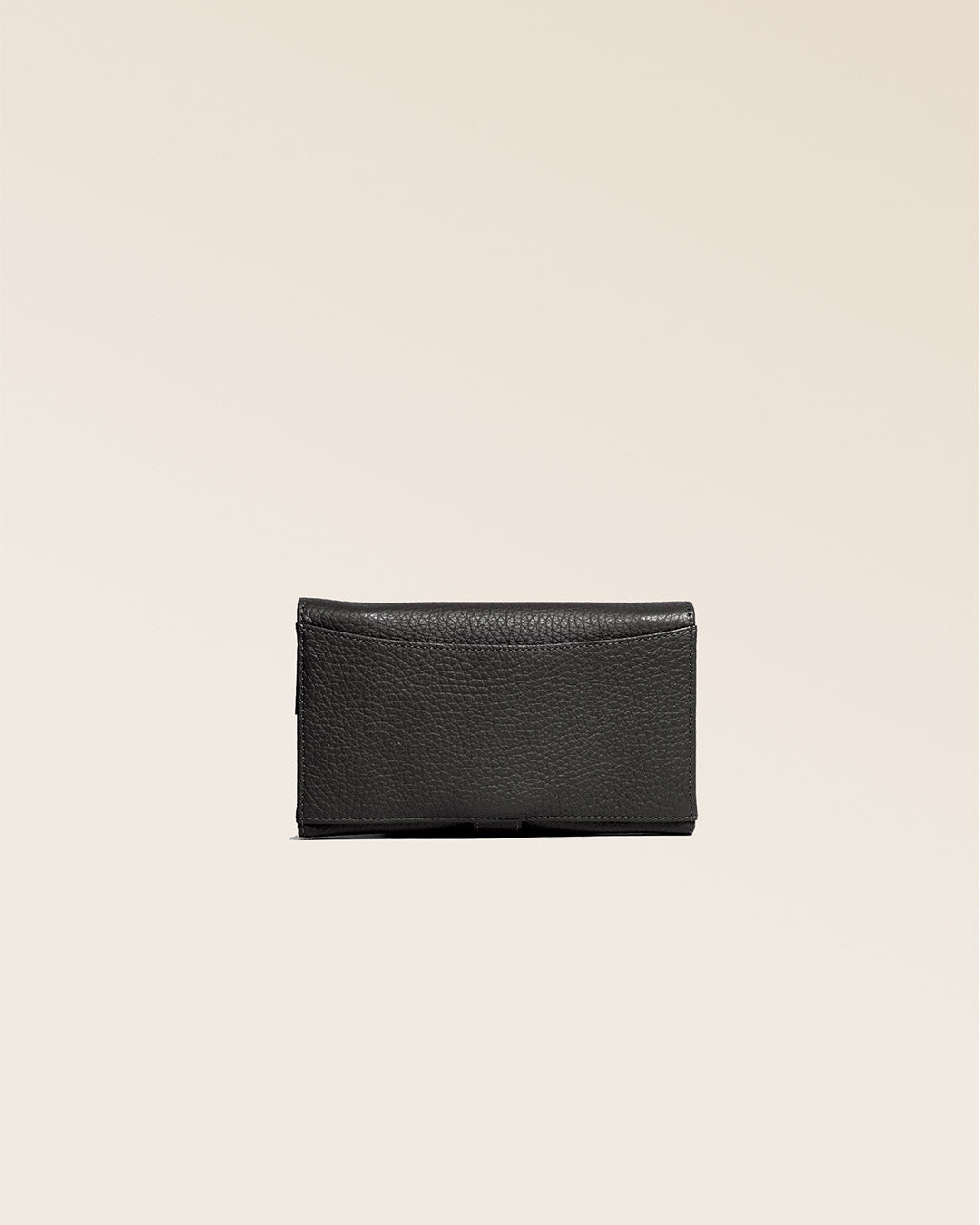 Our Adèle purse in black vicuña-style leather, seen from the back in the studio.