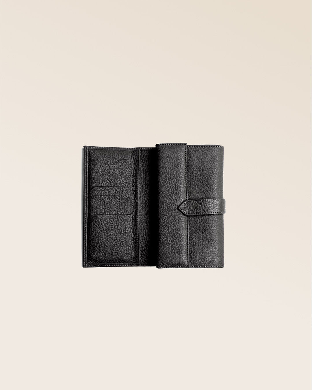 Our Adèle purse in black vicuña-style leather, seen open in the studio.