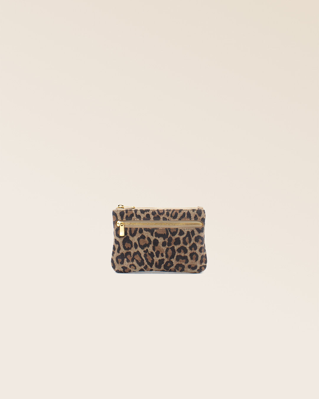 Our Capucine purse in leopard suede calf leather, seen from the front in the studio.