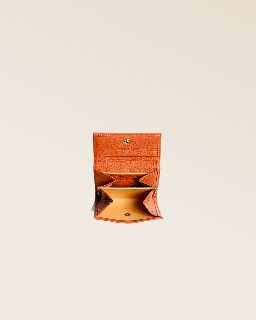 Our Mixte orange vicuña-style leather wallet seen open in the studio.