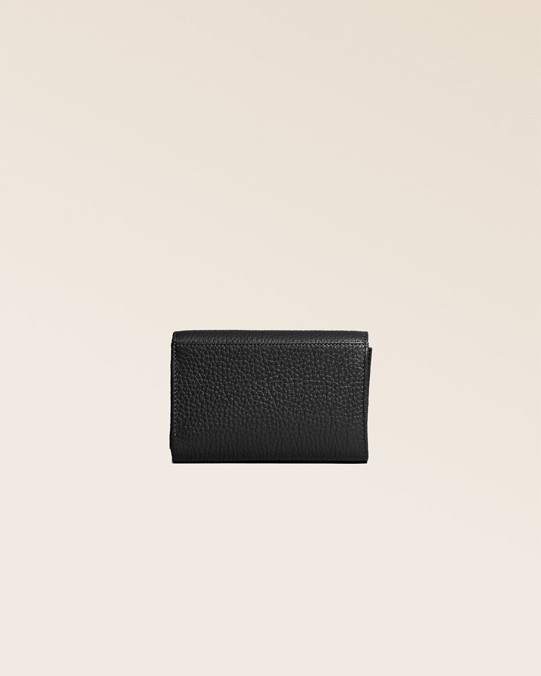 Our Opale purse in black vicuña-style leather, seen from the back in the studio.
