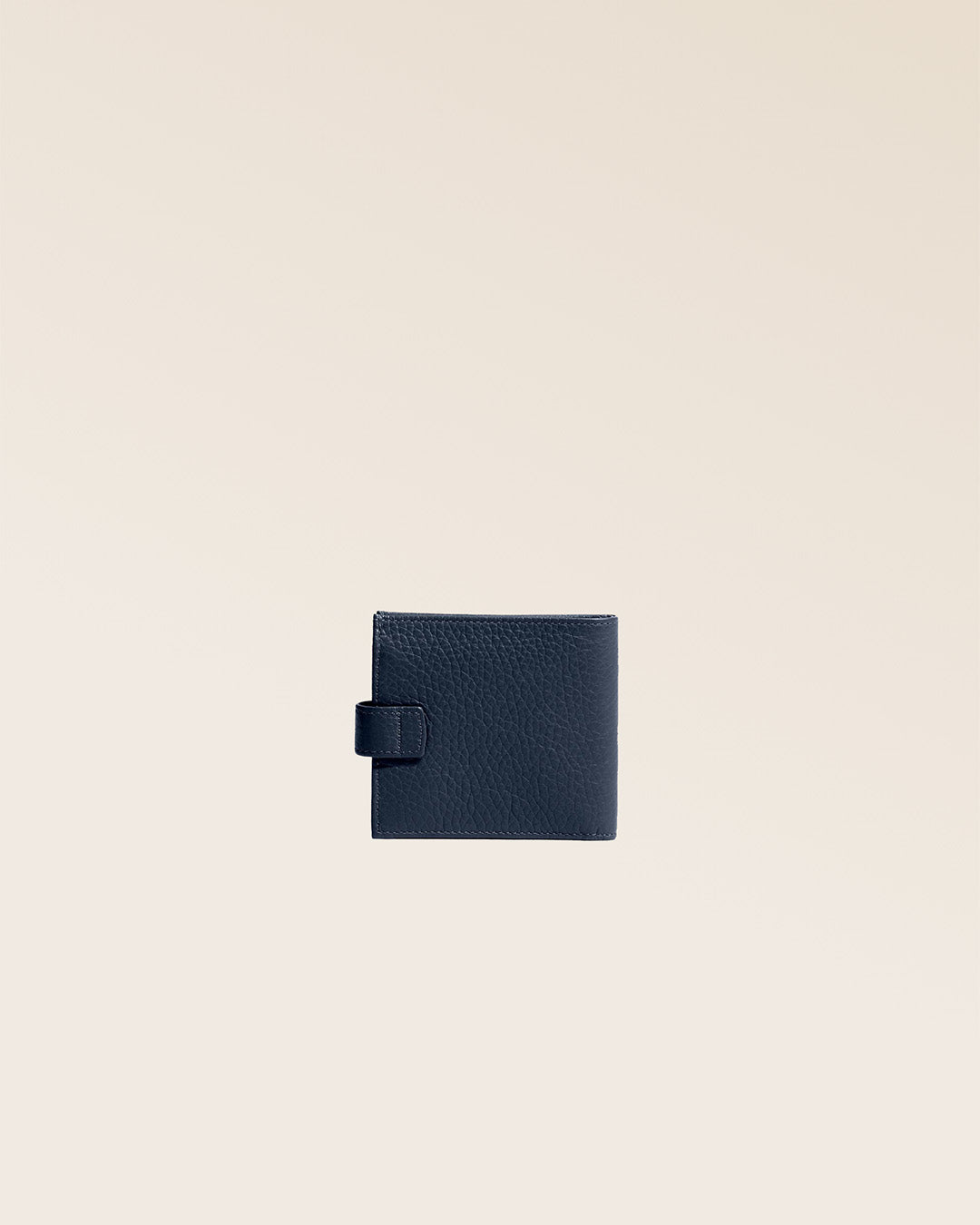 Our navy blue vicuña-style leather Rabat wallet seen from the back in the studio.