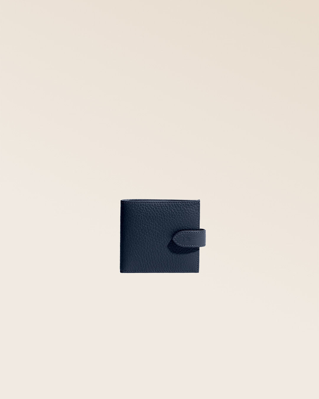 Our Rabat wallet in navy blue vicuña-style leather, seen from the front in the studio.