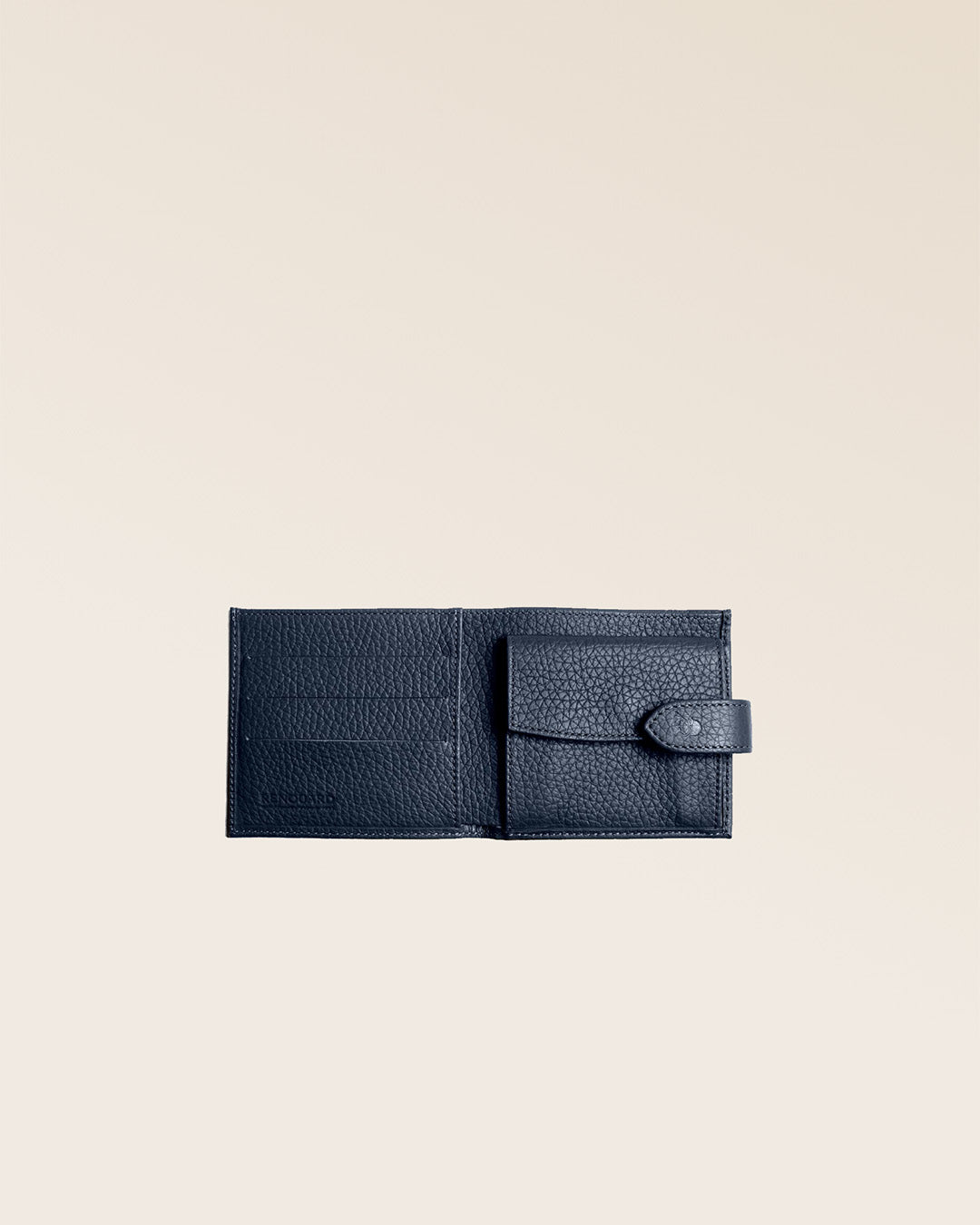Our navy blue vicuña-style leather Rabat wallet seen open in the studio.