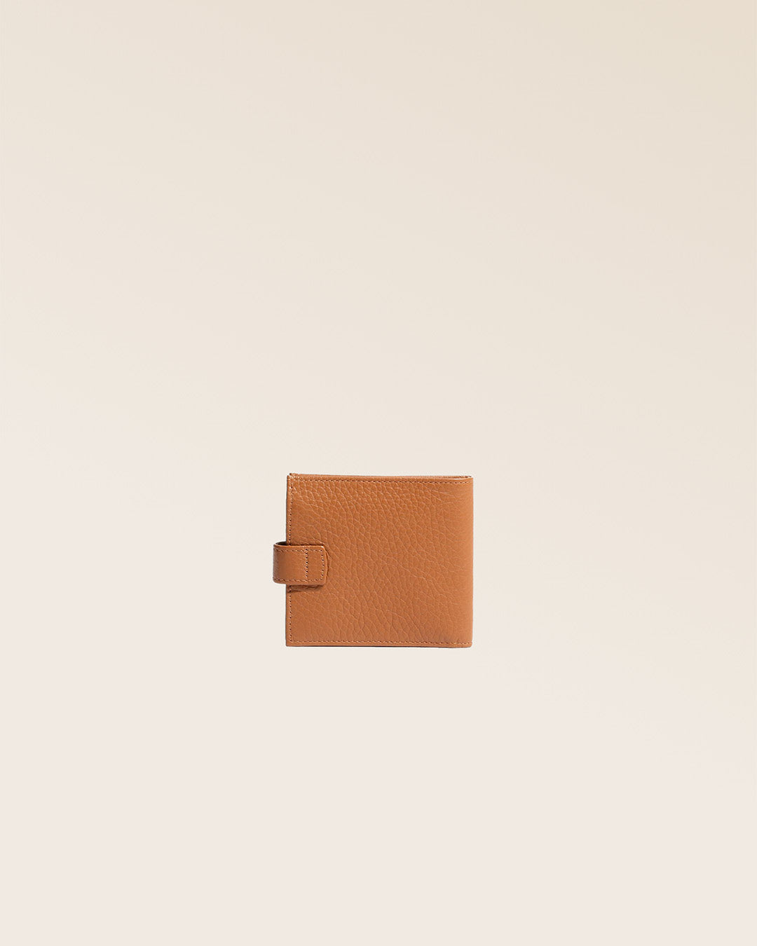 Our Rabat wallet in fawn-colored vicuña leather, seen from the back in the studio.