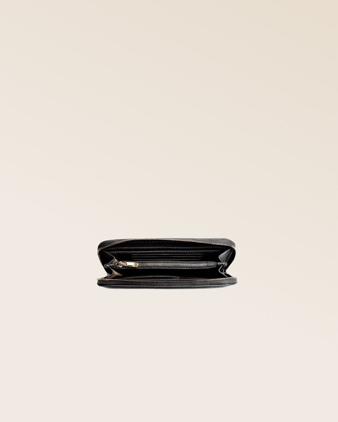 Our Samba wallet in black vicuna-style leather seen from above in the studio.