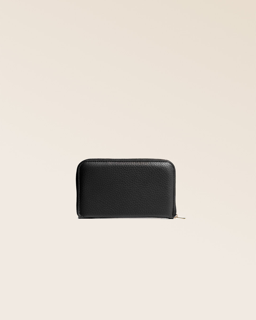 Our Samba wallet in black vicuna-style leather seen from the back in the studio.