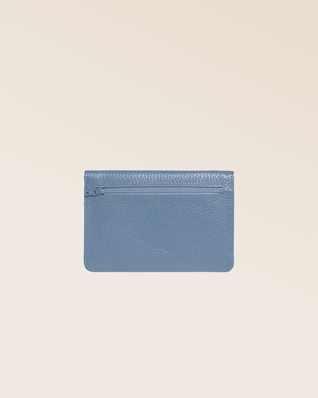 Our Aurore paperweight in cobalt-blue vicuña-style leather, seen from the back in the studio.