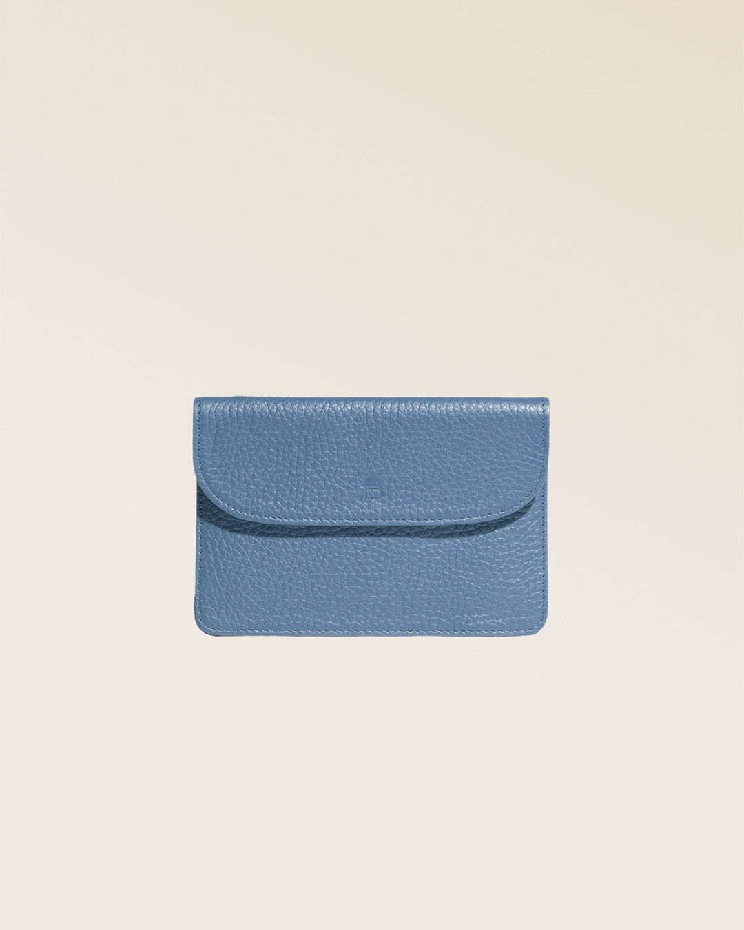 Our Aurore paperweight in cobalt-blue vicuña-style leather, front view closed in the studio.